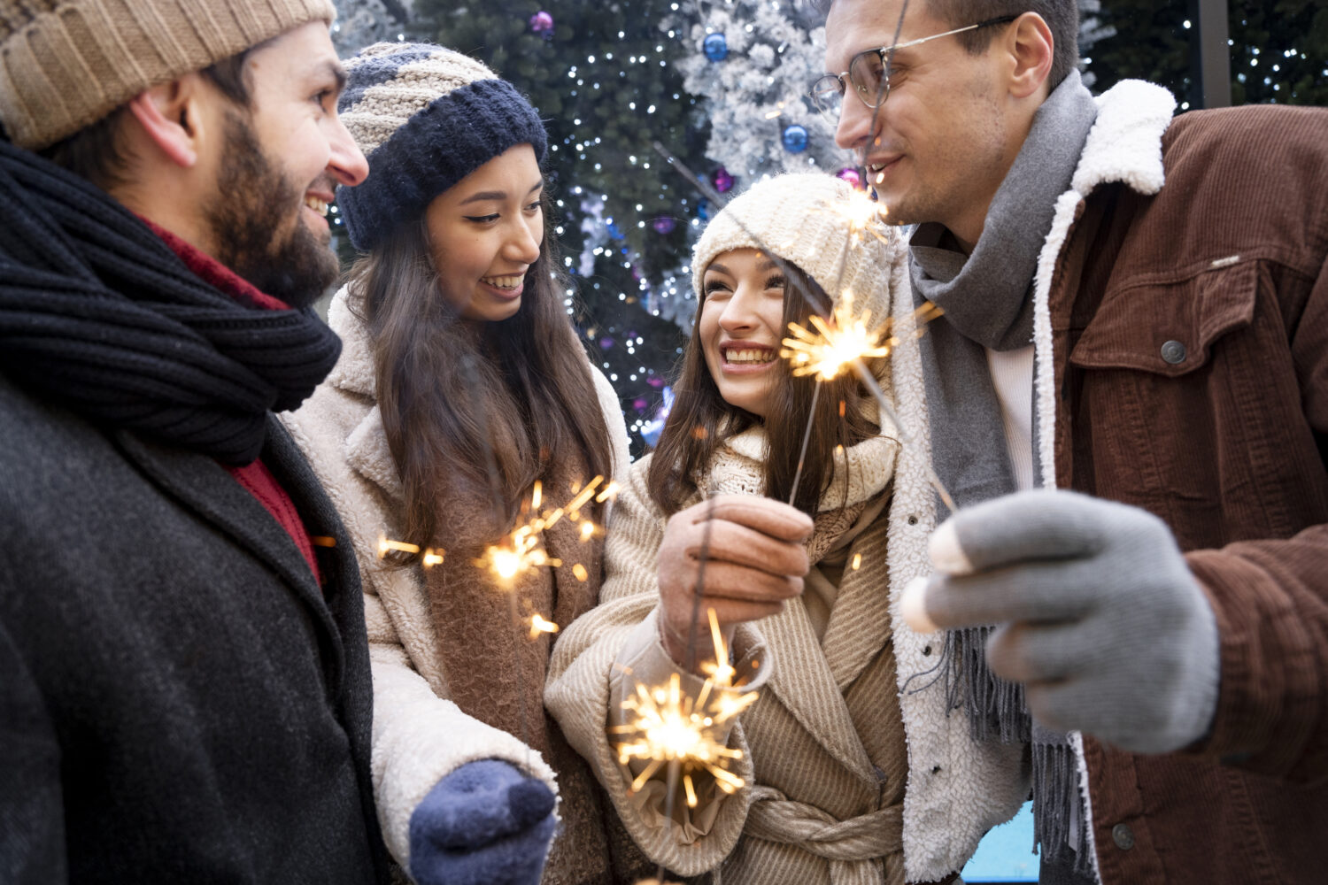 group-friends-holding-sparklers-together